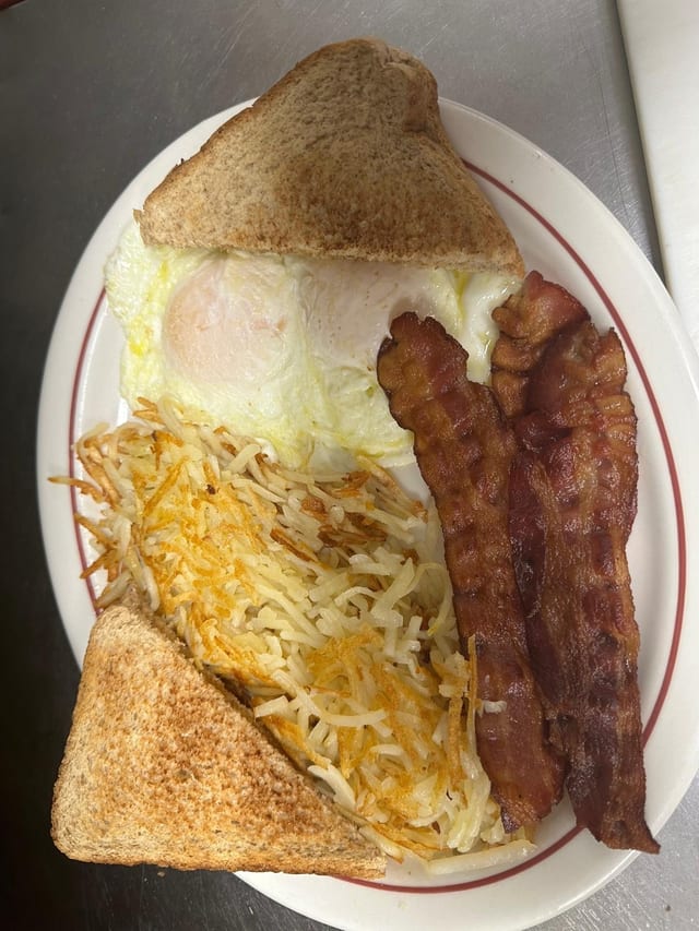 Eggs with Bacon, Sausage or Ham and Toast.